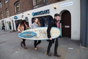Briffa team having fun with a surf board